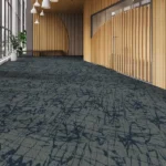 Commercial lobby with patterned grey and navy carpet