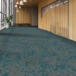 Commercial space with grey and teal abstract-designed carpet