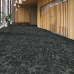 Large room with patterned black and grey carpet