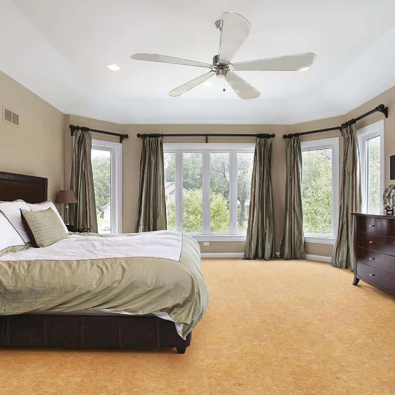 golden-brown wall-to-wall carpet in a bedroom