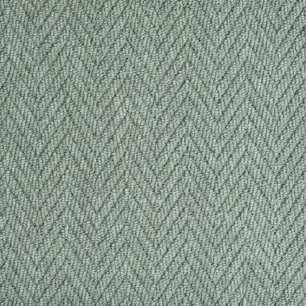 light sage green loop pile carpet with a pronounced woven chevron pattern